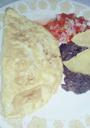 A picture of Manchego Cheese Omelette with Refried Beans.