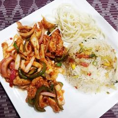 Chicken chilli dry with fried rice and noodles A picture of Chicken chilli dry with fried rice and noodles.