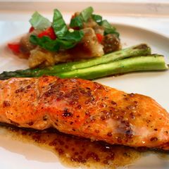 A picture of Salmon with lemon mustard sauce.