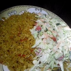 A picture of Jollof rice and colslow.