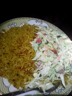 A picture of Jollof rice and colslow.