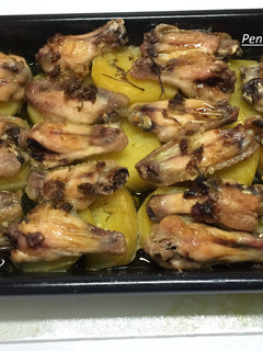 Una foto de Asado de alas de pollo en salsa verde