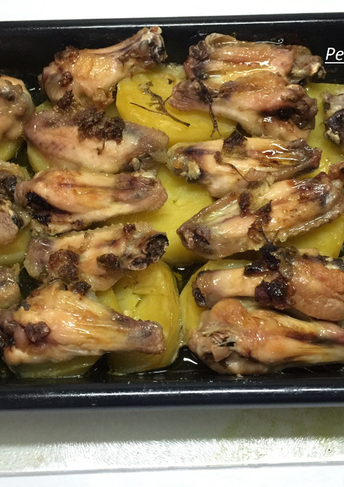 Una foto de Asado de alas de pollo en salsa verde