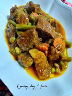 Una foto de Ternera con menestra de yverduras y ras el hanout