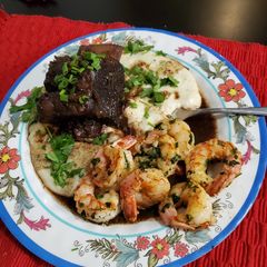 A picture of Brad's Braised Short Ribs w/ Creamy White Polenta & Shrimp Scampi.