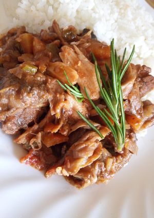 A picture of Beef and mushroom stroganoff served with white rice.