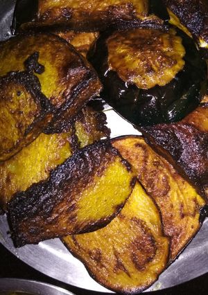 A picture of Fried brinjal and pumpkin.