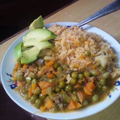 A picture of Carrot rice,green peas.