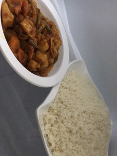 A picture of Rice grit with vegetables soup.
