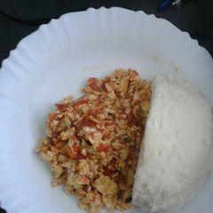 A picture of Scrambled eggs and ugali.
