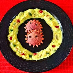 A picture of Baked Chandrakala with Yellow Dip.