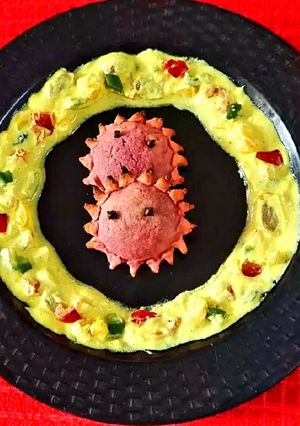 A picture of Baked Chandrakala with Yellow Dip.