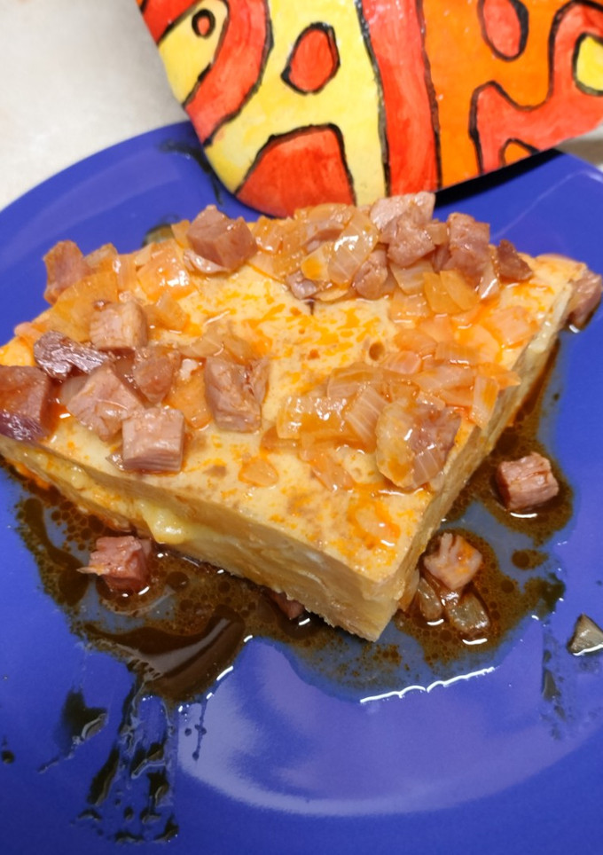 Una foto de Tortilla guisada con jamón