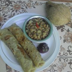 A picture of Coconut beans served with chapati.