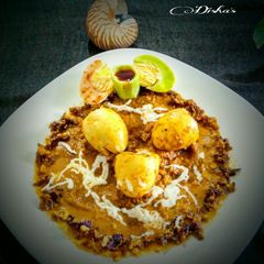 Stuffed Egg Korma With Melted Cheese A picture of Stuffed Egg Korma With Melted Cheese.