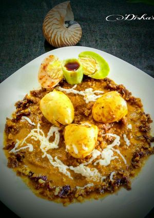 A picture of Stuffed Egg Korma With Melted Cheese.