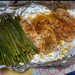 A picture of Oven baked tilapia and asparagus.