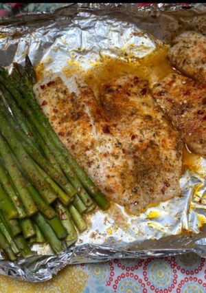 A picture of Oven baked tilapia and asparagus.