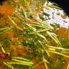 A picture of Tomatoes rasam.