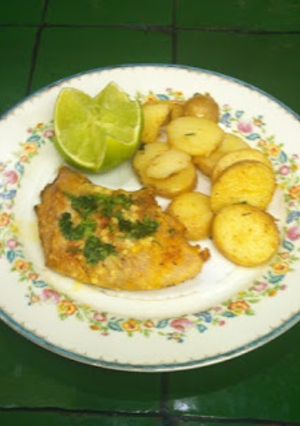 Una foto de Pescado al horno con parmesano