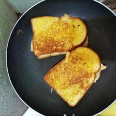 A picture of Tasty egg-meat sandwich.