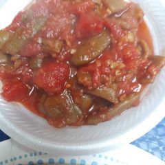 A picture of Tomatoes and Italian cut Green Beans.