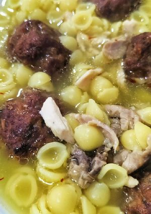 A picture of Chicken and Vegetable Soup with Pasta Shells and Meatballs.
