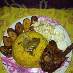 A picture of Fried rice,pep chicken,dodo and coleslaw.