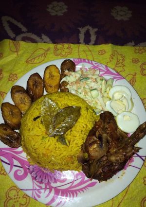 A picture of Fried rice,pep chicken,dodo and coleslaw.