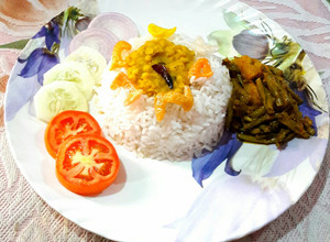 A picture of Bihari Lunch Platter- Dal, Rice, Bodi(Long Beans) Potato Sabzi.