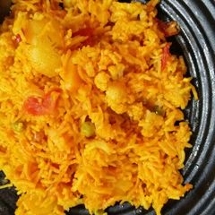 Veg pulav in cooker A picture of Veg pulav in cooker.