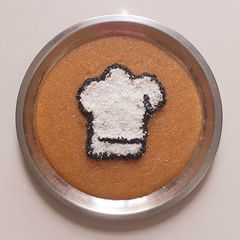 A picture of Rava kesari with dessicated coconut and toasted sesame.