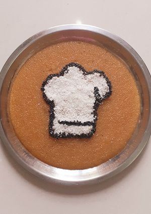 A picture of Rava kesari with dessicated coconut and toasted sesame.