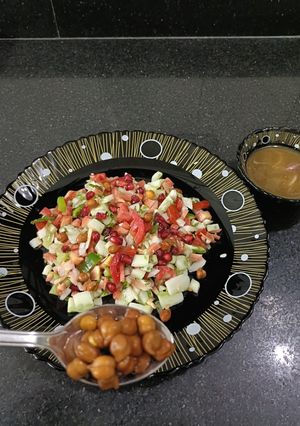 A picture of Kala chana salad with tangi sauce.