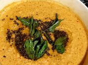 A picture of dosa tomato chutney
