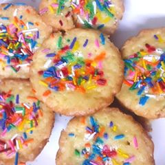 A picture of Rainbow cupcakes.