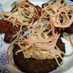 Slaw on sausage and a burger A picture of Slaw on sausage and a burger.