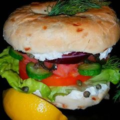 A picture of Mike's Smoked Salmon On Onion Bagles.