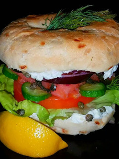 A picture of Mike's Smoked Salmon On Onion Bagles.