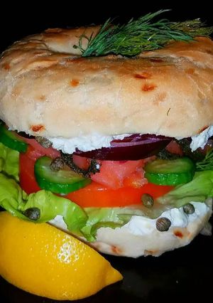 A picture of Mike's Smoked Salmon On Onion Bagles.