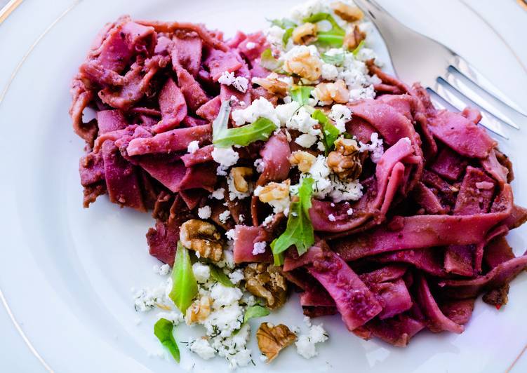 Pasta with a spicy beetroot sauce, feta, dill and walnuts