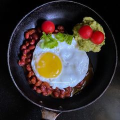 A picture of Egg poach on Red beans.