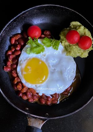 A picture of Egg poach on Red beans.