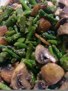 A picture of Sauteed mushrooms and asparagus.