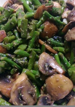 A picture of Sauteed mushrooms and asparagus.