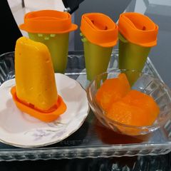 A picture of Mango Popsicles and Lemon cum Orange Flavoured Glucon-The Cubes.