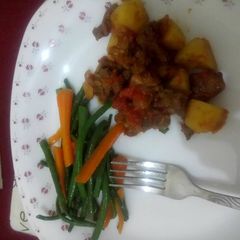 A picture of Stir fry vegetables and goat meat.