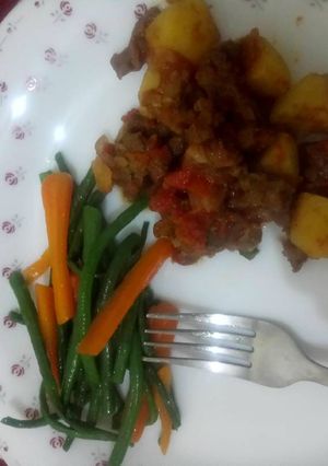 A picture of Stir fry vegetables and goat meat.