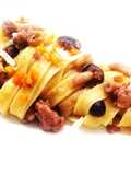 Tagliatelle with Salamella Ragù, Pioppini Mushrooms, and Walnuts