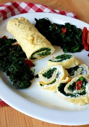 A picture of Egg White Frittata Roll with Ricotta, Spinach, and Sun-Dried Tomatoes.